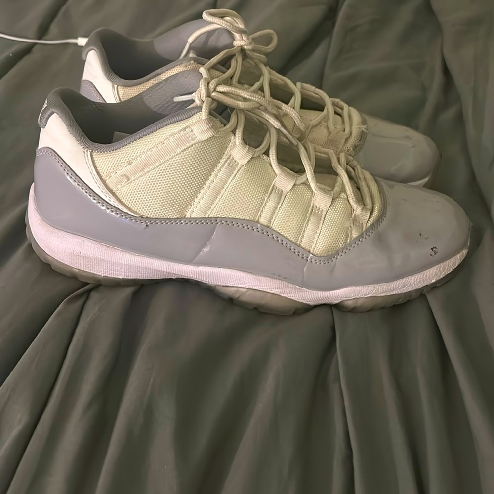 Gray and white Jordan 11s